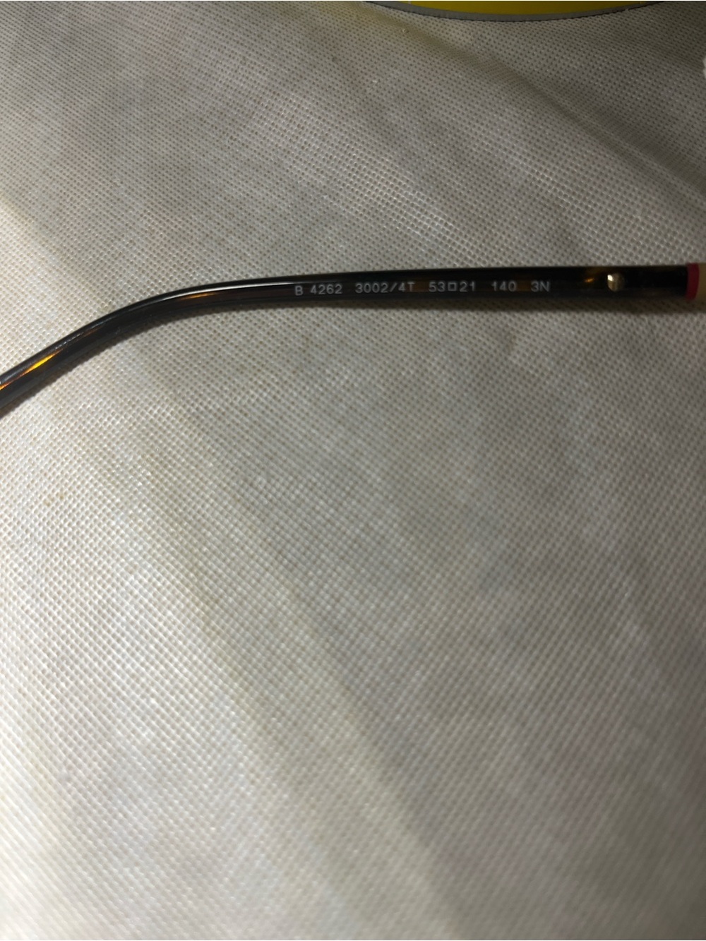Burberry Tortoiseshell Eyeglass Temple Arm with Subtle Red Accent